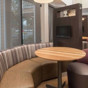 The hotel’s media pods offer a cozy setting for socializing or work, and each has a coffee table and TV.