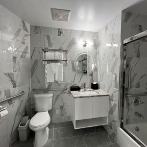 Guest bathroom with shower at Starlight hotel. 