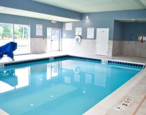 Indoor pool with chairs at Holiday Inn Express & Suites Bensenville - O'Hare.