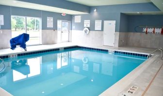 Indoor pool with chairs at Holiday Inn Express & Suites Bensenville - O'Hare.