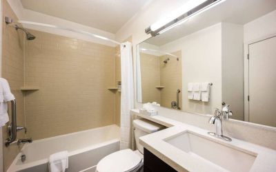 Guest bathroom in Sonesta Simply Suites Cleveland North Olmsted Airport, furnished with sink, lavatory, shower, and bath.