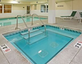 Relaxing indoor pool area at Country Inn & Suites By Radisson, Chicago O'Hare South.