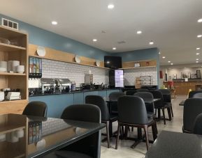 Dining and coworking space at Country Inn & Suites By Radisson, Chicago O'Hare South.