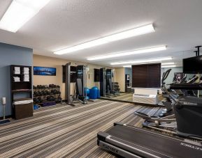 Sonesta Simply Suites Des Moines’ fitness center is equipped with rows of free weights, plus an assortment of exercise machines, and a TV.