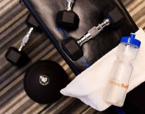 Sonesta Simply Suites Dallas Galleria’s fitness center includes a range of free weights for guests to use (including on a bench).