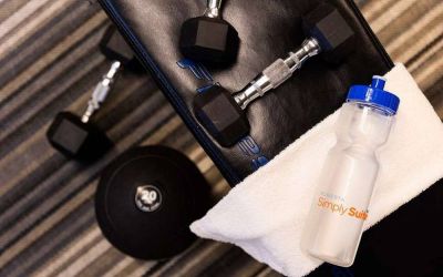 Sonesta Simply Suites Dallas Galleria’s fitness center includes a range of free weights for guests to use (including on a bench).