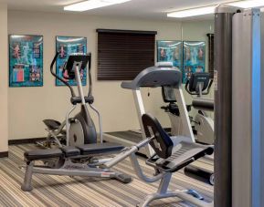 Sonesta Simply Suites Pittsburgh Airport’s fitness center is equipped with an assortment of exercise machines and a bench for those using weights.
