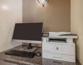 The hotel business center includes monitor, keyboard, and mouse, plus a printer.
