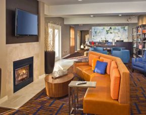 The hotel’s lobby lounge features a fireplace and widescreen TV, plus comfortable seating and coffee tables.