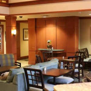 Sonesta ES Suites Portland Vancouver 41st Street’s lobby has extensive seating and numerous small tables.