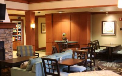 Sonesta ES Suites Portland Vancouver 41st Street’s lobby has extensive seating and numerous small tables.