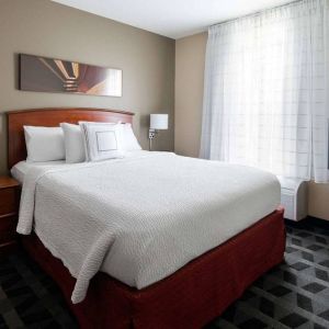 Double bed guest room in Sonesta Simply Suites Seattle Renton, featuring a large window and widescreen television.