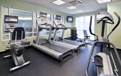 Sonesta Select Seattle Renton’s fitness center is equipped with both free weights and a variety of exercise machines, and has large windows.
