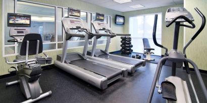 Sonesta Select Seattle Renton’s fitness center is equipped with both free weights and a variety of exercise machines, and has large windows.