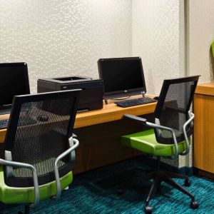 Sonesta Select Seattle Renton business center, with two computer workstations and a printer between them.