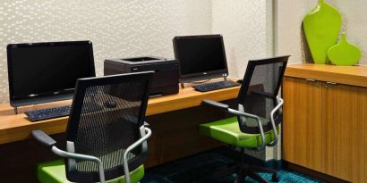 Sonesta Select Seattle Renton business center, with two computer workstations and a printer between them.