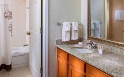 Sonesta ES Suites Birmingham Homewood guest bathroom, with sink, mirror, and bath (including shower).