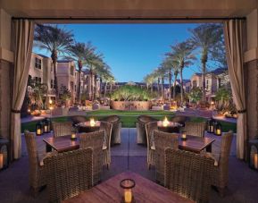 Sonesta Suites Scottsdale Gainey Ranch’s fire pits are surrounded by comfy chairs, with more tables and chairs, and candle-style lights, nearby for outdoor socializing.