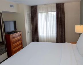 Sonesta ES Suites San Antonio Northwest - Medical Center guest room, furnished with double bed and widescreen television.