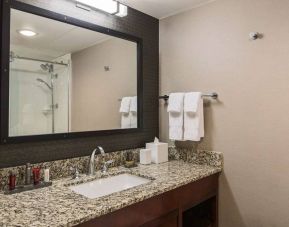 Sonesta Nashville Airport guest bathroom, with shower, sink, and mirror.