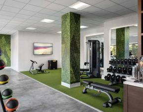 Sonesta Irvine’s fitness center is equipped with both exercise machines and free weights, in addition to gym balls and nature-themed decor.