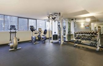 Royal Sonesta Chicago Downtown’s fitness center is equipped with free weights and assorted exercise machines, and has a mirrored wall and city views.