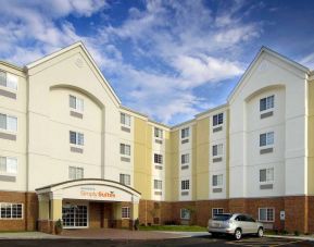 The hotel’s exterior has parking close to the front door, which features potted plants and has the Sonest Simply Suites name above it.