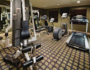 Sonesta ES Suites Dallas Las Colinas’ fitness center has a wall-mounted television and assorted exercise machines for guests to use.