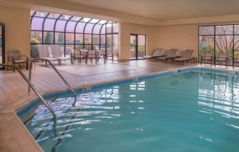 Sonesta Select Columbia’s indoor pool has large windows for plenty of light, and both loungers and chairs by the side.