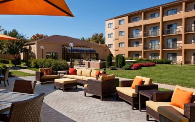 The hotel’s patio has armchairs and sofas, with coffee tables, as well as shaded tables and chairs.