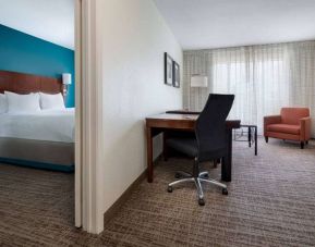 Sonesta ES Suites Dallas Medical Market Center double bed guest room, including a workspace desk and chair.