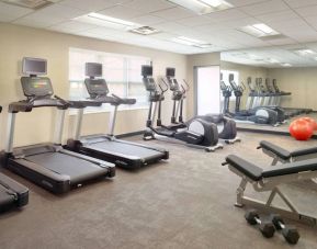 Sonesta ES Suites Raleigh Durham Airport Morrisville’s fitness center is equipped with free weights, benches, and various exercise machines.