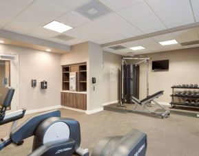 Fitness center equipped with both a range of exercise machines and free weights, plus a TV, at Sonesta ES Suites Reno.