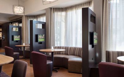 The hotel’s media pods are each furnished with a coffee table, TV, and comfortable seating.