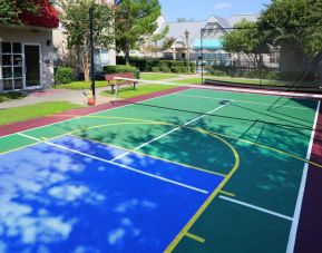 The hotel’s sports court is suitable for multiple activities including basketball and tennis, and has a bench for spectators.