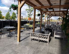 Outdoor lounge and dining space at Novotel Toronto Vaughan Centre.