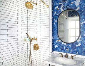 Guest bathroom with shower at Hotel Figueroa.