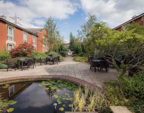 Pretty outdoor garden with seating at Hilton Leicester.