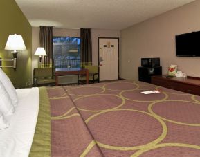Day room with TV, microwave, and mini-fridge at Super 8 By Wyndham Houston/Webster.