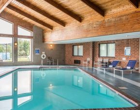 Indoor pool with pool loungers at EnVision Hotel St. Paul South.