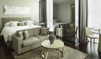 Spacious king room with lounge at Fraser Residence Menteng Jakarta.