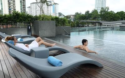 Stunning outdoor pool with lounge chairs at Capri By Fraser Johor Bahru.