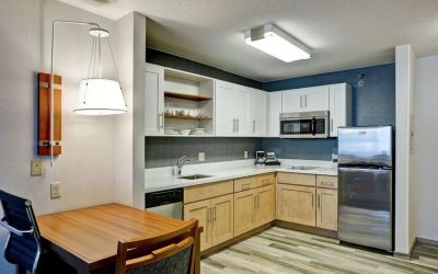 In-room kitchen at Homewood Suites By Hilton Chicago-Downtown.
