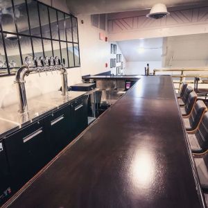 Bar and coworking space at EnVision Hotel Miami International Airport.