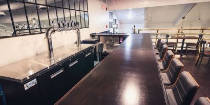 Bar and coworking space at EnVision Hotel Miami International Airport.