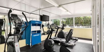 Fitness center at EnVision Hotel Miami International Airport.