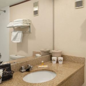 Private guest bathroom at EnVision Hotel Miami International Airport.
