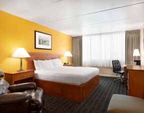Spacious king room with work desk at EnVision Hotel Miami International Airport.