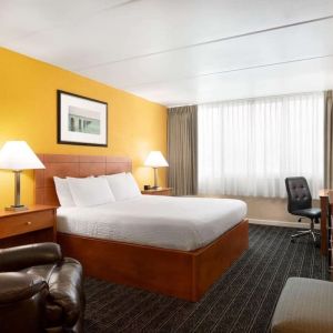 Spacious king room with work desk at EnVision Hotel Miami International Airport.