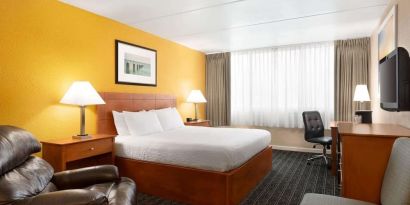 Spacious king room with work desk at EnVision Hotel Miami International Airport.